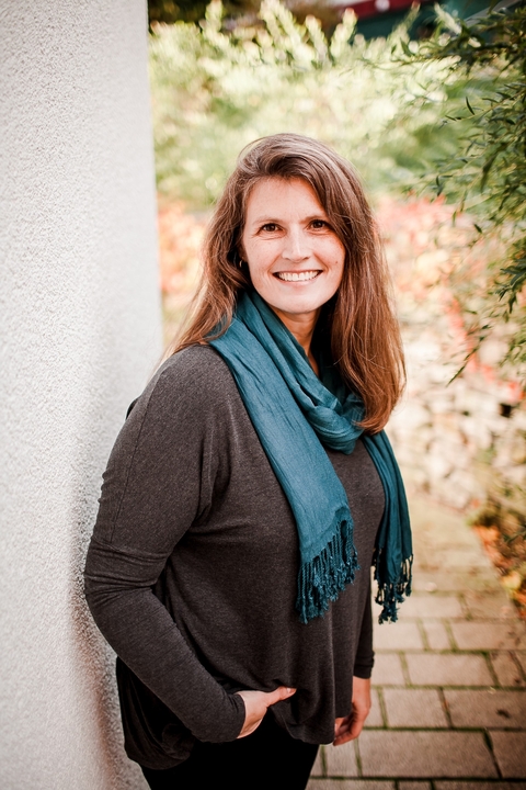 Jamie Nachtigall, a white woman with brown hair and blonde highlights, smiling at the camera.