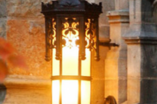 a lantern glows outside of a Yale building.