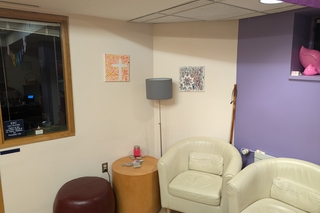 armchairs and small tables in the chaplains office lounge