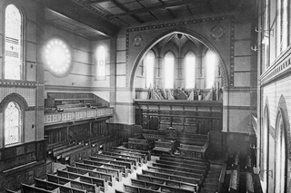 A black and white photo of the interior of Battell Chapel, taken from the balcony.