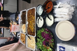 Food served buffet style at a Wholy Queer meeting