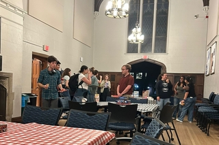 Students at tables in Dwight Hall common room.